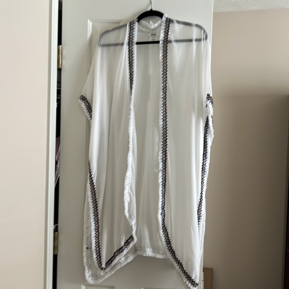 unique shawl. Light weight White with cross stitch like edging around shawl